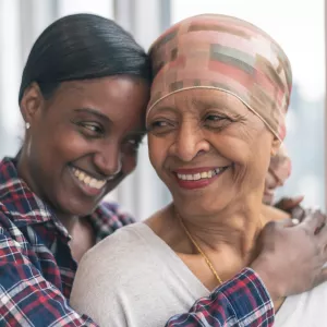 An Adult Daughter Hugs Her Senior Mom
