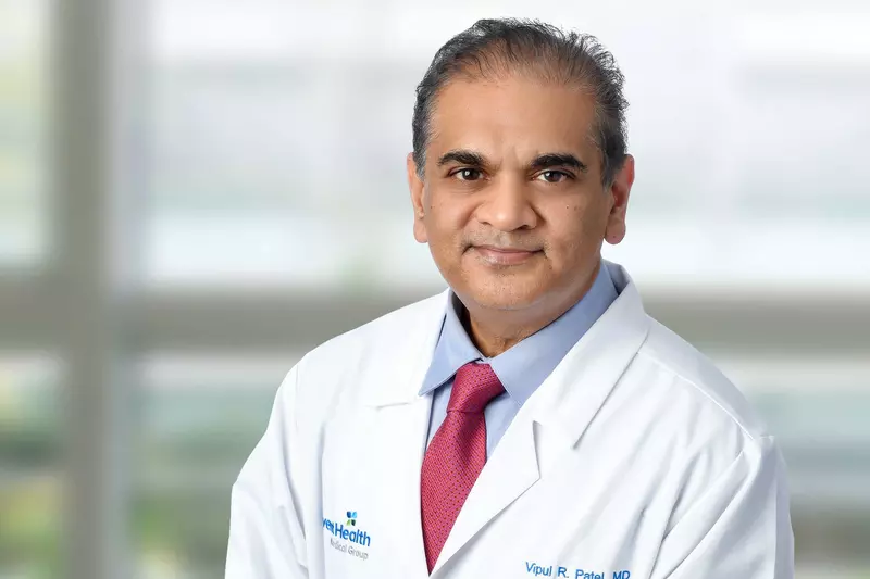 A professional portrait shot of Doctor Patel