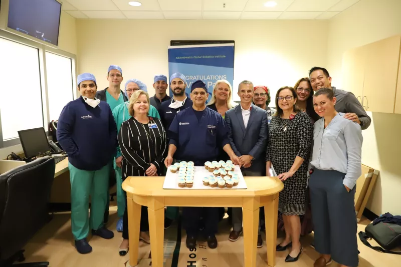Dr. Vipul Patel and his team celebrating his milestone of 13,000 surgeries