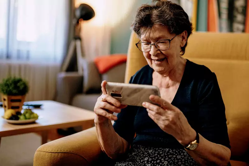 An older woman using video chat. 