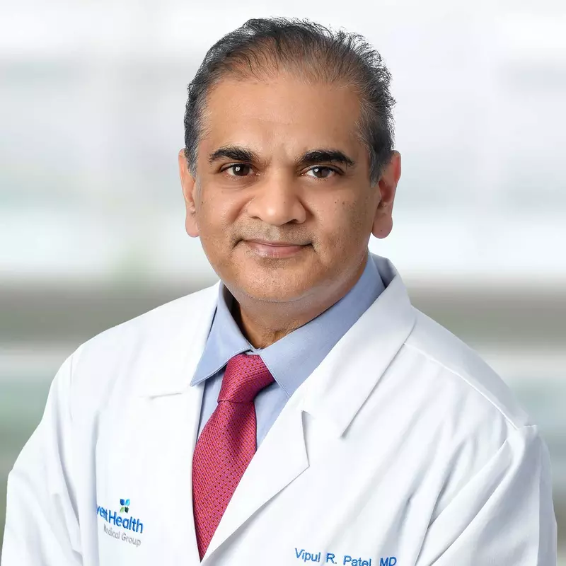 A professional portrait shot of Doctor Patel
