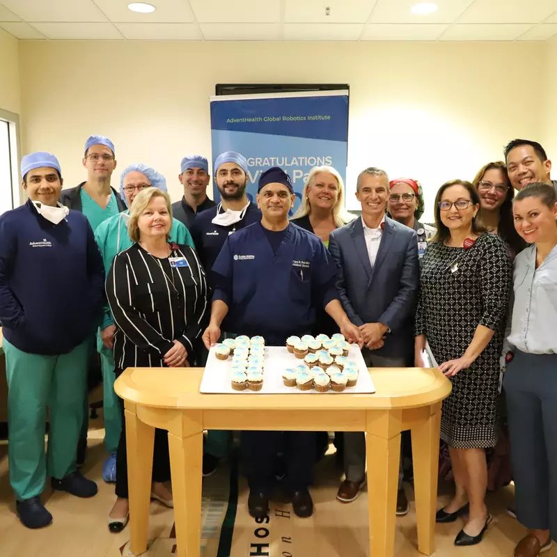Dr. Vipul Patel and his team celebrating his milestone of 13,000 surgeries