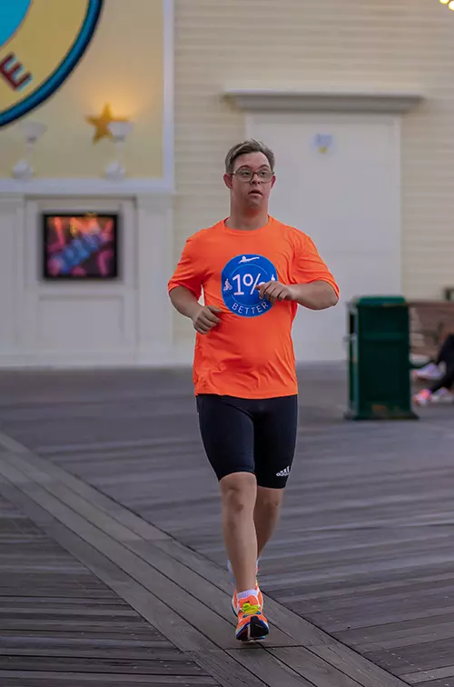 Chris Nikic running at Disney's Boardwalk Resort.
